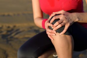 woman knee pain  300x201 Beverly Hills Sports Medicine